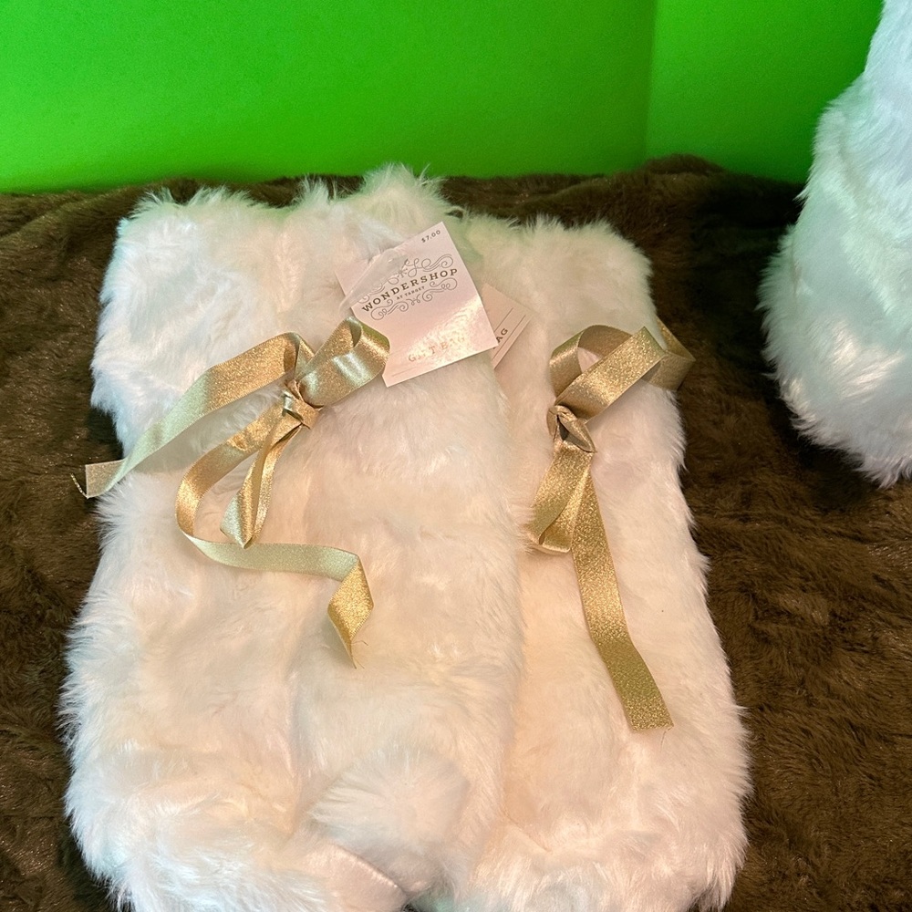 White Faux Fur gift bags with Gold Ribbon